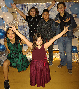 Five happy students at the Winter Dance