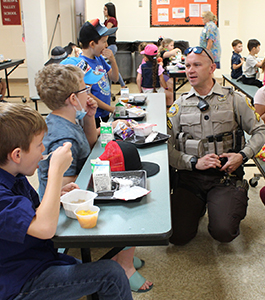 Policeman visiting students at school